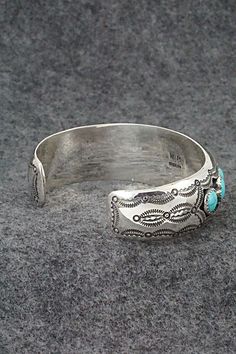 This beautiful turquoise and sterling silver bracelet was expertly crafted by Navajo silversmith Wilbert Muskett Sr. The inside of the bracelet is signed W.M. and stamped sterling.Size: 5 3/8" (will fit up to a 6 5/8" wrist)Gap: 1 1/4"Width: 3/4"Free shipping on all orders! We ship with USPS and always include tracking. All orders ship within a day of payment.Returns are accepted up to 30 days after you receive your order. Just send us a message. Our shop offers cash back or store credit. The it Sterling Silver Bracelet, Native American Jewelry, Turquoise Sterling Silver, Free Jewelry, Sterling Silver Bracelets, Silver Bracelet, Gap, Turquoise, Bracelet