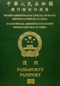 a green passport with chinese writing on it