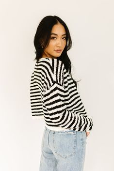 it’s a tank, it’s a cardigan – it’s a tank + cardigan combo. detailed with a retro-inspired black + white stripe pattern, this cropped sweater tank + cardigan set is a spring outfit staple. wear them together or separately to elevate any outfit. black + white // two piece set, scoop neckline, buttons, drop shoulder paired with our sicily distressed denim model is 5'8" + wearing a small measurements are approximate + taken while laying flat small : bust 44” length 18.5” tank: small : bust 28” len Chic Striped Cardigan For Spring, Chic Knit Cropped Sweater For Spring, Chic Striped Sweater For Spring, Spring Cropped Sweater For Layering, Striped Sweater For Spring Layering, Striped Knit Sweater For Spring, Striped Knit Top For Spring Layering, Trendy Striped Summer Sweater, Spring Striped Knit Top For Layering