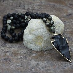 Obsidian is a natural volcanic glass born quickly out of cooled lava from the volcano. This is why it has the most potent energies. It has the elements of fire, water, and earth.Obsidian carries the inherent frequency of protection, sealing the aura and removing energetic attachments, hooks, and cords, as well as eliminating negative energies within the self and one’s environment.This black stone has an excellent spiritual grounding vibration and also has strong psychic protection energy that sh Meditation Jewelry With Natural Lava Stones, Lava Stone Jewelry For Meditation With Natural Stones, Black Lava Stone Bohemian Jewelry, Bohemian Black Lava Stone Jewelry, Lava Stone Necklace With Natural Stones For Gift, Black Lava Stone Necklace Spiritual Style, Obsidian Beaded Jewelry For Healing, Bohemian Jewelry With Natural Lava Stones, Black Lava Stone Spiritual Jewelry