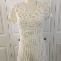 Crochet With Underdress, Ivory Color Cream Crochet Dress With Lace Trim, Elegant Fitted Crochet Dress With Crochet Trim, Elegant Beige V-neck Crochet Top, Spring Cream Crochet Dress, Elegant Cream Crochet Sleeveless Top, White Crochet Dresses For Spring, Fitted Beige Crochet Top With V-neck, Beige Fitted Crochet Top With V-neck, Elegant Cream Sleeveless Crochet Top