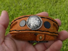 Adjustable Concho Cuff Bracelet Gift, Adjustable Black Hand Tooled Bracelet, Vintage Adjustable Leather Bracelet With Concho, Adjustable Stamped Jewelry For Collectors, Adjustable Brown Leather Bracelet, Artisan Adjustable Black Cuff Bracelet, Unique Adjustable Round Cuff Bracelet, Adjustable Artisan Engraved Leather Bracelet, Artisan Engraved Adjustable Leather Bracelet