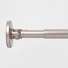 a close up view of the side of a metal curtain rod with an eyelet