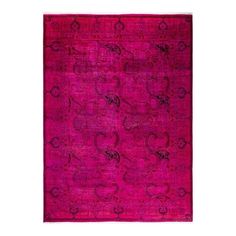 a pink rug with an intricate design on the front and back side, in various colors