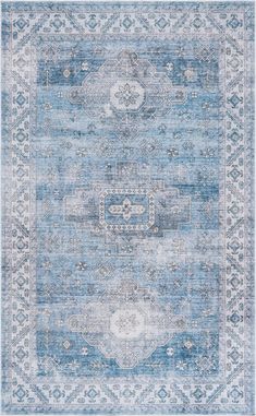 a blue and white rug with an ornate design