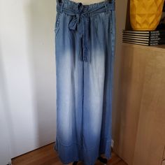 Beautiful & Flowy Lightweight Wide Leg Denim Pants With Belt! Brand: Zenana Color: Faded Blue Size: Large Cut: Wide Leg/Straight Leg Design/Details: Paperbag Style Waist With Elastic Lightweight Denim Pants. Wide Leg And 100% Lyocell. Side Pockets And Removable Belt. Condition: New Without Tags (Nwot) Waist: 14 Length: 43 All Pics Shown Are Of The Actual Item. Please Review Carefully For Additional Listed & Unlisted Details. Smoke Free Home Pet Free Home Bundle And Save On Shipping! Please Visit Denim Blue Cargo Jeans For Summer, Relaxed Fit Medium Wash Pants For Day Out, Denim Blue Full Length Flare Jeans For Summer, Summer Full-length Denim Blue Flare Jeans, Summer Dark Wash Full-length Jeans, Casual Light Wash Pants For Day Out, Summer Full-length Denim Jeans, Washed Denim Straight Leg Bottoms, Straight Leg Denim Bottoms Washed