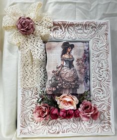 an altered picture with flowers and lace on the edge is displayed in front of a white background