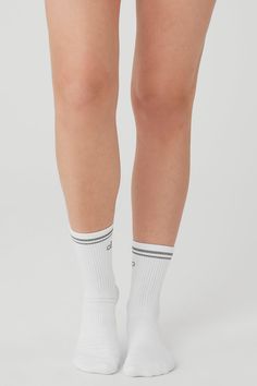 Step into your new favorite socks—they’re stretchy and sweat-wicking (for performance) and finished with a reflective Alo logo (for subtle flash in low light). Don’t miss the functional details, like ribbing at the ankles, ribbing at the midfoot and slight padding at the heels and toes for a comfortable fit. Sweat Resistant Athleisure Socks For Gym, White Stretch Socks For Sports, Sweat Resistant Gym Socks Athleisure, Sweat Resistant Gym Socks In Athleisure Style, White Stretch Sports Socks, Sporty Breathable Socks For Workout, Sporty Sweat-resistant Gym Socks, Sporty Compression Breathable Socks, White Breathable Stretch Socks