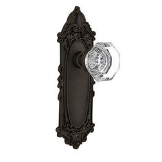 an ornate door handle with a crystal knob