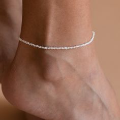 B R I N L E Y ∙ P E A R L ∙ A N K L E T Capture the perfect boho-chic summer look with the Brinley Pearl Anklet. Handcrafted with freshwater pearls, each pearl shines delicately in the light - ready for wearing to the beach for a day in the sun or for an elegant night out on the town. * Material: High Quality Solid 925 Sterling Silver * Finish: Sterling Silver ∙ 18K Gold * Featuring a Beaded Anklet with dainty Freshwater Pearls, adjustable from 9 to 10 Inches. * All our work is custom made by ha Dainty White Wedding Anklets, Dainty Adjustable Anklets For Wedding, Dainty Handmade Anklets For Beach, Dainty White Anklets Perfect For Gifts, Delicate White Anklet As A Gift, Dainty White Anklets As Gift, Dainty Summer Beach Anklets, Dainty White Anklet Suitable For Gift, Dainty White Anklets For Gift