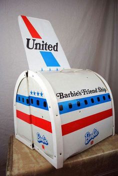 a mailbox shaped like an airplane with the word united painted on it