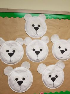 paper plate polar bear faces on a bulletin board