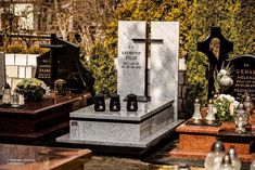 several headstones and crosses are on display in a cemetery