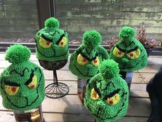 four hats made to look like angry birds are sitting on a table next to each other