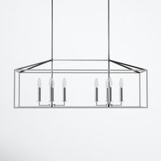 a rectangular chandelier with five lights hanging from the ceiling