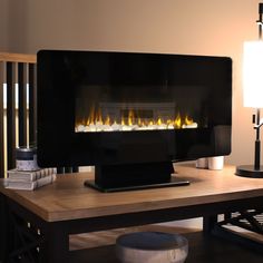 a computer desk with a fireplace in the middle