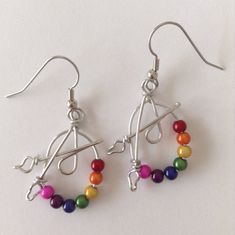 These earrings are a great gift for artists and art teachers. Beads are called Miracle Beads. Wire is non-tarnish aluminum. Surgical steel earring hooks are hypo-allergenic. I have been making custom wire art and jewelry for 30 years. I started in 1989 selling jewelry on the streets of Montreal. Over the years I have participated in many craft shows, exhibitions and sold my work in gallery shops across Canada including the National Gallery of Canada. My husband and I specialize in custom wedding Adjustable Artsy Nickel-free Hoop Earrings, Artsy Nickel-free Dangle Hoop Earrings, Artsy Wire Wrapped Earrings Gift, Adjustable Nickel-free Artsy Beaded Earrings, Artsy Adjustable Nickel-free Beaded Earrings, Adjustable Nickel-free Beaded Artsy Earrings, Artsy Adjustable Hypoallergenic Jewelry, Artsy Nickel-free Hoop Earrings As Gift, Adjustable Silver Plated Hoop Earrings As Gift