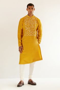 Mustard yellow chanderi kurta with an embroidered yoke. Comes with churidar.
Component: 2
Pattern: Embroidery
Type Of Work: Abstract
Neckline: Mandarin
Sleeve Type: Long sleeves
Fabric: Chanderi
Color: Yellow
Other Details: 
Abstract embroidery
Occasion: Mehendi and Puja - Aza Fashions Semi-stitched Kurta With Gold Embroidery For Festivals, Traditional Churidar With Gold Embroidery For Designer Wear, Yellow Salwar Kameez With Chikankari Embroidery For Transitional Season, Transitional Season Yellow Salwar Kameez With Chikankari Embroidery, Yellow Kurta With Chikankari Embroidery For Diwali, Transitional Yellow Chikankari Embroidery Salwar Kameez, Unstitched Yellow Kurta With Chikankari Embroidery, Designer Yellow Kurta With Chikankari Embroidery, Unstitched Chanderi Kurta With Gold Embroidery