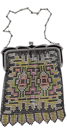 Late 1920s/early 1930s painted mesh bag by Whiting and Davis! 5x6 inch with a 5.5 inch drop to the chain Pink, green, yellow, black painted mesh.  Black enamel painted frame.  Excellent condition. At the sides when frame is fully opened there are a couple breaks in the rings, this is typical wear I see with these bags. One break at the bottom as seen in pics. Otherwise paint appears to be in near perfect condition on the mesh as well as the frame.  I NEVER see these in such fine condition! An exceptional piece. Thanks for looking! Pink Green Yellow, 1920s Art, 1920s Art Deco, Evening Handbag, Mesh Bag, Black Enamel, Black Paint, Clutch Handbag, Yellow Black