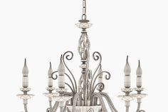 a large chandelier with many lights hanging from it's sides and arms