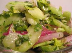 a close up of a plate of food with broccoli and onions