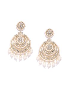 These beautiful off-white circular chandbali earrings come with kundan stone studs, beads & pearls, are gold-plated, and are secured with a post and back closure. These handcrafted classic drop chandbalis are versatile and can be easily paired with most outfits for any festive occasion. Classic with a touch of Bam! Product color may vary based on the monitor or screen you are using.See FAQ for more details. Size Length: 8 cm Details Material: BrassStones: Kundan & Artificial BeadsPlating: Gold-p Chandbali Pearl Drop Danglers For Reception, White Chandbali Pearl Earrings For Reception, Heavy White Chandbalis For Reception, White Kundan Chandbali Chandelier Earrings, Pearl Chandbali Bridal Earrings With Pearl Drop, White Chandbali Chandelier Earrings For Reception, Bridal Chandbali Earrings With Pearl Drop, Pearl Drop Chandbalis For Diwali Reception, White Chandbali Bridal Earrings For Reception