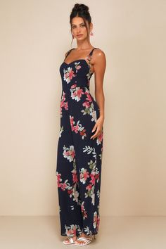 We're blown away by how many compliments the Lulus Stylish Certainty Navy Blue Floral Tie-Strap Wide-Leg Jumpsuit calls in! A lovely floral print adorns lightweight, woven crepe as it shapes this refined jumpsuit that falls from tying spaghetti straps into a subtle sweetheart neckline and a princess-seamed bodice. High, fitted waist sits atop wide pant legs that end at full-length hems. Smocking and hidden zipper/clasp at back. Fit: This garment fits true to size. Length: Floor length. Size medi Floral Print Jumpsuits And Rompers With Spaghetti Straps, Fitted Floral Print Jumpsuits For Garden Party, Fitted Floral Jumpsuits And Rompers For Garden Party, Elegant Floral Print Jumpsuits And Rompers For Vacation, Floral Print Jumpsuits And Rompers For Garden Party, Blue Floral Print Jumpsuits And Rompers For Party, Party Blue Floral Print Jumpsuits And Rompers, Country Wedding Guest Dress, Engagement Party Guest