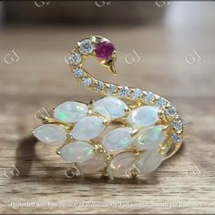 ▪️ TITLE 2Ct Marquise Cut Opal Swan Shape Engagement Ring 14K Yellow Gold Finish  Wedding Anniversary Ring, Birthday Gift, Ring. ▪️ ITEM DESCRIPTION Main Stone Carat Weight : 2Ct Main Stone Shape : Fire Opal Main Stone Color : Rainbow ▪️ Available In : 925 Sterling Silver, 14K White Gold Plated, 14K Rose Gold Plated, 14K Yellow Gold Plated, 10K White Gold, 14K White Gold, 18K White Gold ▪️ SHIPPING It usually takes 7 -10 days to make and 9-15 days to ship We apply a tracking number for every sin White Hallmarked Birthstone Wedding Ring, Pear-shaped White Opal Ring For Anniversary, White Hallmarked Birthstone Ring For Anniversary, White Opal Anniversary Ring, Wedding Anniversary Ring, Birthday Gift Ring, Engagement Ring Shapes, Wedding Anniversary Rings, Color Rainbow