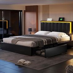 a bedroom with a large bed and black furniture