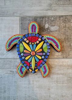 a colorful sea turtle made out of beads