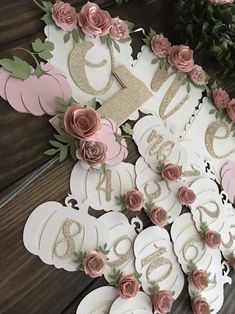 a table topped with lots of white and pink decorations