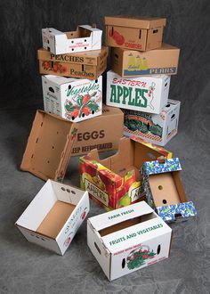 an assortment of boxes are stacked on top of each other in order to be packed