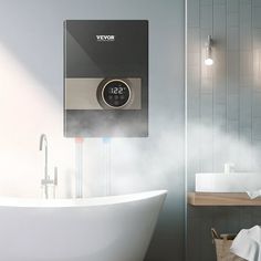 a white bath tub sitting next to a wall mounted thermostaer in a bathroom