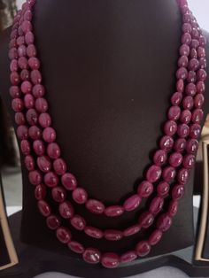 AAA 818 Carat Fine Quality Natural Ruby Smooth Plain 21 Inch Necklace Adjustable code Stone :Natural Ruby Shape :- fancy oval Necklace - 21 inch 3 line string Size :- 6x8mm to 9x12mm Weight :- 818 carat Polish :- Handmade Purity :- 100% Natural Gemstone color - red makes a great gift for your loved ones. It is known as the 'love stone' as the message it emits is the strong vibration of unconditional love, joy, warmth and healing. As quartz crystals are profound amplifiers of energy, it may help Necklace Ruby, Oval Necklace, Oval Beads, Quartz Crystals, Natural Ruby, Beads Necklace, Gemstone Colors, Quartz Crystal