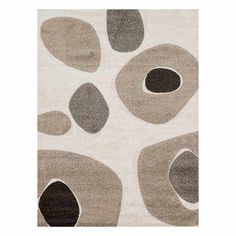 an area rug with circles on it in grey and beige colors, including one circle