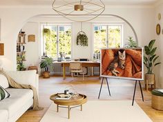 a living room filled with furniture and a cat on the television screen in front of it