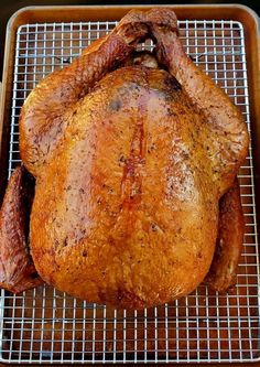 a roasted turkey on a grill with the words pellet grill smoked turkey above it