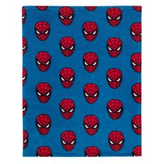 a blue towel with spider - man faces on the front and bottom, all over it