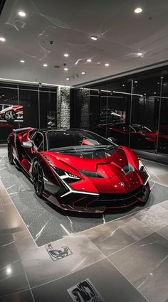 a red sports car is parked in a showroom