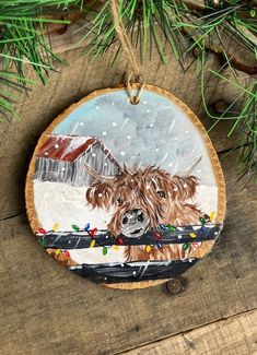 a wooden ornament with a painting of a dog on it