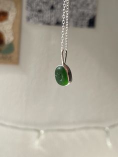 Handmade sterling silver Sea Glass necklace, made with recycled silver, and genuine Sea Glass from the Jurassic Coast. This necklace has one small piece of bright green Sea Glass, and is very dainty and elegant.  This necklace is a perfect gift for a special occasion, and is perfect for Sea Glass lovers! The chain is 18" (45cm), and has an easy closure. All of the silver on the necklace is 925 Sterling Silver, including the chain and small jump rings! Feel free to message me for any additional information, or for commissions/custom requests! Minimalist Recycled Glass Jewelry For Gifts, Nickel Free Recycled Glass Necklace Gift, Untreated Silver Necklace As A Gift, Minimalist Recycled Glass Necklaces For Gifts, Nickel Free Silver Necklace Of Recycled Glass, Minimalist Handmade Necklaces With Recycled Glass, Minimalist Handmade Necklace With Recycled Glass, Silver Recycled Glass Necklace For Gift, Handmade Silver Necklace With Recycled Glass