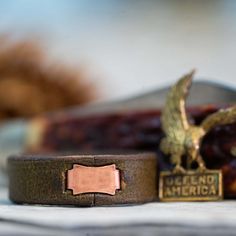 Note, due to the popularity of our leather rings, it may take 1-2 weeks for your order to ship. Don't worry though, it will be worth it! Our Leather Ring Leather has been everywhere and done everything. It's classy, dependable, rugged and refined. There's nothing that feels quite like it and we wanted to have a ring crafted from it that was like nothing else you've ever seen or worn. Our Clean Style A leather ring for those that like to keep it simple. There is no design stamped into this ring. Vintage Leather Jewelry With Waxed Finish, Masculine Everyday Jewelry With Leather Strap, Everyday Engraved Leather Jewelry, Vintage Leather Jewelry With Patina, Vintage Leather Jewelry With Strap, Masculine Leather Jewelry For Everyday Use, Brown Leather Jewelry For Father's Day, Vintage Leather Strap Jewelry For Everyday, Everyday Vintage Jewelry With Leather Strap