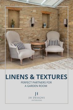 two chairs sitting next to each other in front of a stone wall with the words linens and textures perfect partners for a garden room