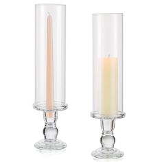 two clear candles sitting next to each other