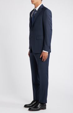 Navy wool brings polish and distinction to a suit that's tailored with traditional detailing and styled to make a versatile addition to any formal wardrobe. 31" length (size 54EU) Jacket has notched lapels; chest pocket; flap pockets; interior pockets; side vents Cuff buttons may not be attached. Jackets purchased at full price can have the sleeve length customized for free at your local Nordstrom Trousers have zip fly; slant pockets; back button-welt pockets Jacket is lined 100% wool Dry clean Blue Single Button Formal Suits, Tailored Blue Wool Suit, Timeless Suits With Welt Pockets, Tailored Blue Three-piece Suit For Formal Occasions, Timeless Suits With Concealed Placket, Blue Wool Suits For Workwear, Classic Blue Three-piece Suit With Single Button, Blue Wool Suits For Work, Blue Three-piece Suit For Formal Occasions