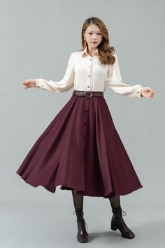 ★★ Welcome to my Ylistyle's shop！！！ This womens burgundy midi high waist swing wool skirt decorated with buttons, can be customized to your size.   It's a great gift for mom or friend.  Our long pleat swing circle wool skirt, it looks simple and elegant. ★★FEATURES 25% wool, other fiber,nylon Polyester lining Two Side pockets Right zipper closure Elastic waist at back Midi skirt, Wool circle skirt Button down skirt Autumn winter wool skirt Dry clean Belt not for sale ★★ More color from Color4 of Wool fabric swatch https://etsy.me/37PMzfD ★★ The model's height approx 170 cm (5′ 7″) with the 84 cm (33") bust, 66 cm (26") waist. She is wearing the wool skirt in size XS (US2) ★★ Please select custom order according to the follow situation Can't find your size Your height is over 175cm Your wei Fall A-line Skirt With Buttons, Elegant Brown Skirt With Buttons, Fall Office Skirt With Button Closure, Buttoned Skirt For Office In Fall, Fall Office Skirt With Buttons, Elegant Burgundy Midi Skirt, Elegant Winter Skirt With Button Closure, Formal Fall Skirt With Buttons, Winter Workwear Skirt With Buttons