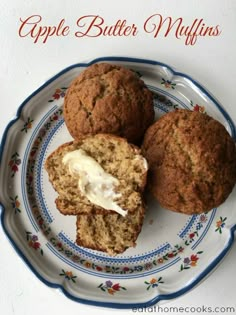 apple butter muffins on a blue and white plate with the words apple butter muffins