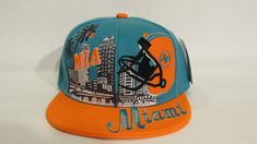 Miami Snap Back Caps  Features Miami  Adjustable Snapback Hat Miami  3D  Embroidery across the front. Helmet 3D Back Embroidered.  All logos and letters on crown embroidered, stitched on  100% Polyester | Flat Bill Contrasting button and grommet ventilation Adult size adjustable with plastic snap back GREAT VALUE - WITH FAST SHIPPING! Snap Backs, Snapback Cap, Snapback Hats, Trucker Cap, Miami, Caps Hats, Pet Supplies, Display Homes, Purses And Bags