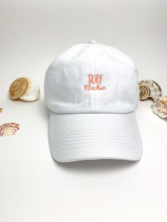 Embroidered Surf Babe Design on Dad Hat Various Hat Colors Various thread colors for design Classic Dad Hat Fit Hats are: -100% Cotton -Adjustable back strap -Classic brushed gold metal buckle -One size fits most Example Shown: -White dad hat -Coral Text Color options for design slightly vary due to variants in screen display Please feel free to message me with any questions :) White Dad Hat, Bachelorette Party Hat, Entrepreneur Gifts, Gifts For Surfers, Linen Bag, Personalized Embroidered, Cute Packaging, Navy Floral, Dad Hat