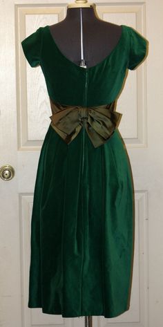 "Vintage 1950s Kay Selig Velvet and Satin party dress. This is truly a fashion for the ages! Colors: Green Style:3020 Size: 12 Measurements: (taken flat) Shoulder to Shoulder: 14\" Bust: 16\" Waist: 14\" Length Shoulder to Hem: 44.25\" Please measure a dress that fits you to use as a size comparison as vintage sizes are smaller that sizes today. Label: Kay Selig New York Care Instructions: Dry Clean Only. Do Not Use Petroleum Solvents or Coin Operated Method of Dry Cleaning. Have any questions? 1950s Style Prom Dress With Fitted Bodice, Classic Fitted Prom Dress, Fitted A-line Vintage Dress For Party, Retro Formal Dress With Fitted Bodice, Fitted Evening Dress For Vintage Events, 1950s Style Dress With Fitted Bodice For Formal Events, 1950s Style Dress With Fitted Bodice For Formal Occasions, 1950s Style Formal Dress With Fitted Bodice, Retro Vintage Dress With Fitted Bodice For Formal Occasions